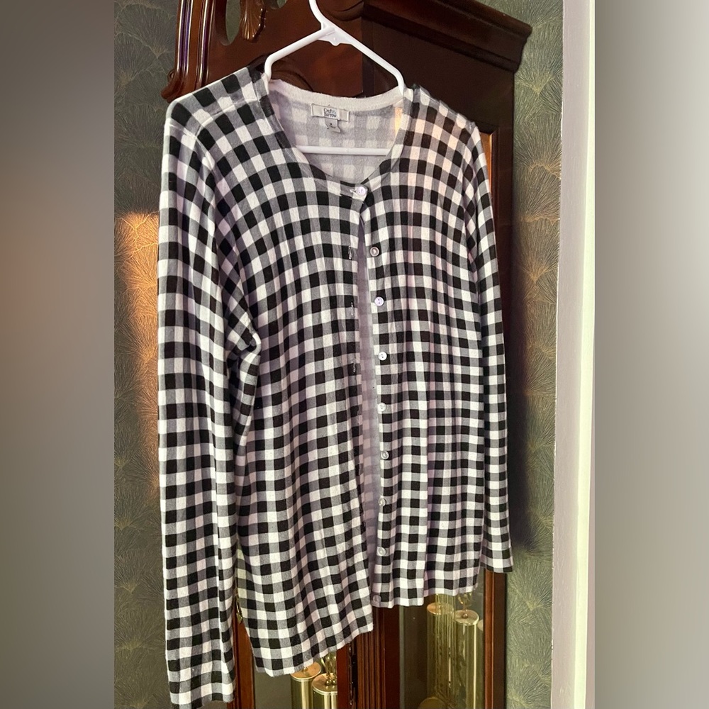 Women’s button down top with long sleeves. Very soft and warm